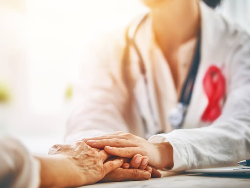Patient being comforted by a medical professional.